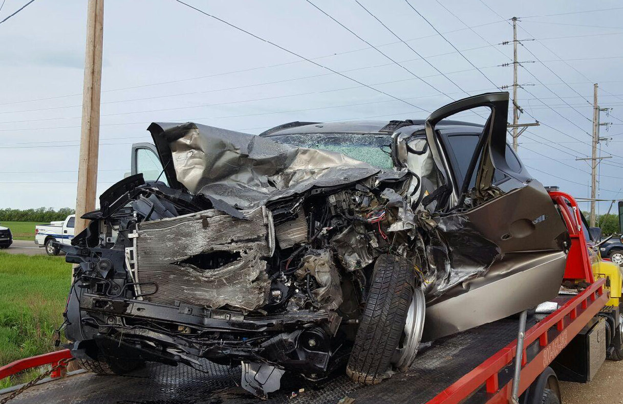 Horton's vehicle is towed from the scene Wednesday. Photo courtesy Salina Police Department